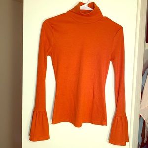 High neck orange sweater with bell sleeves